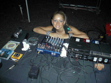 Ashley Winn prepares the sound system before the performance