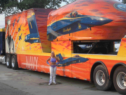 Galaxy Girl poses next to the Navy Truck