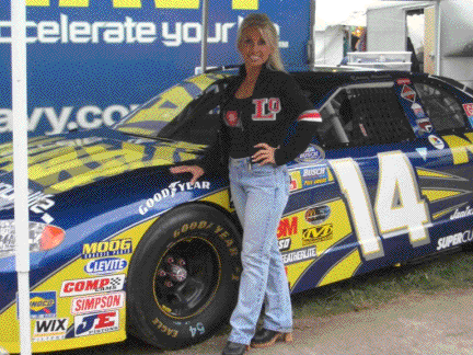 Galaxy Girl  poses with the Navy race car.