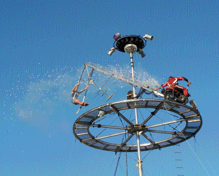 The sparks fly as John increases speed on his motorcycle.